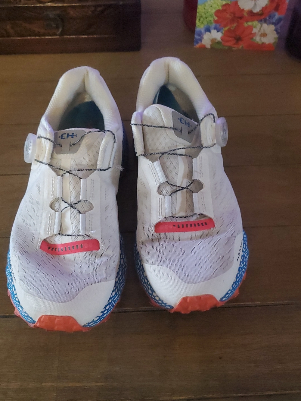Under ARMOR Mens size 9, White Athletic Shoes with Blue & Orange Accents